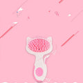 Pink cat comb with nylon bristles and ABS resin body, 7.2cm wide, on white background