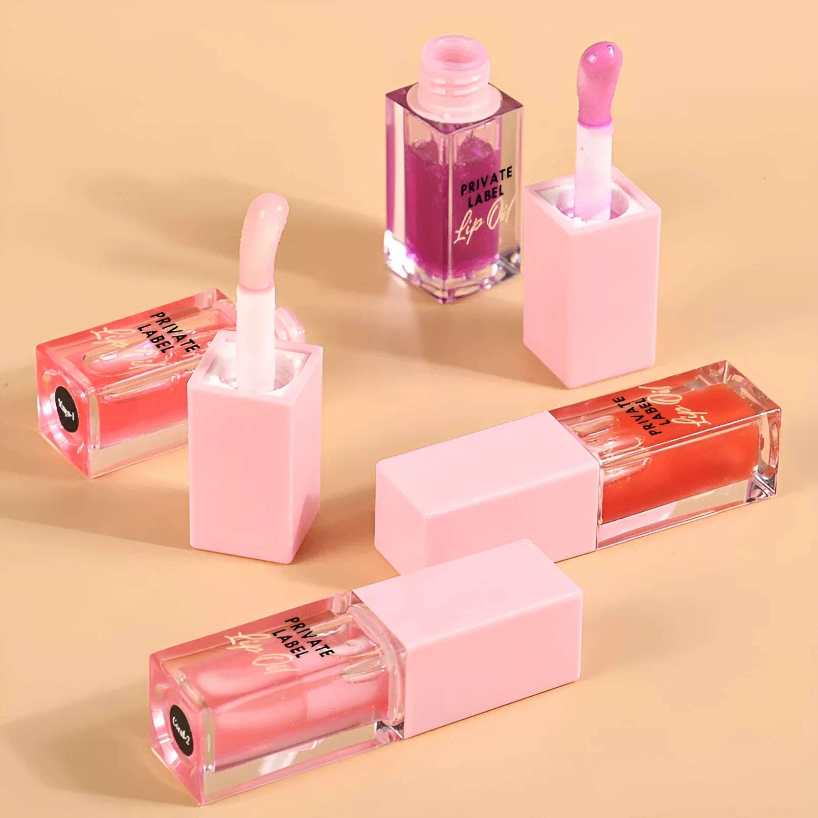 Natural transparent lip gloss tube in six fruit shades: bird of paradise, cherry, coral, mango, strawberry, watermelon