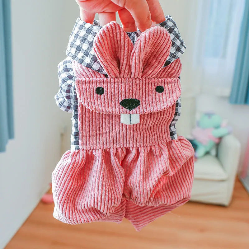 Four-legged plaid polyester pet overalls in black grid top, with full leg coverage, on a light background