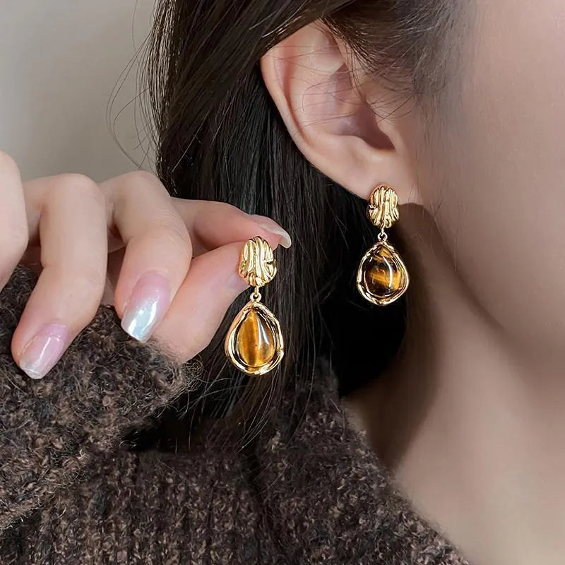 Handmade 3-pair women's holiday earring set showing geometric tassel designs in electroplated alloy