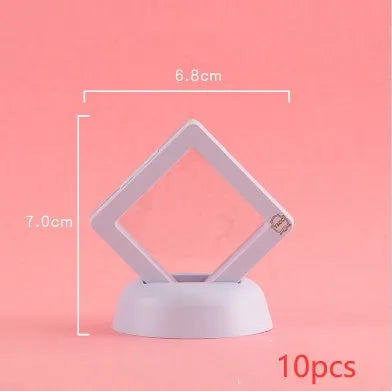 3D floating display case holding coins and jewellery between transparent membrane sheets