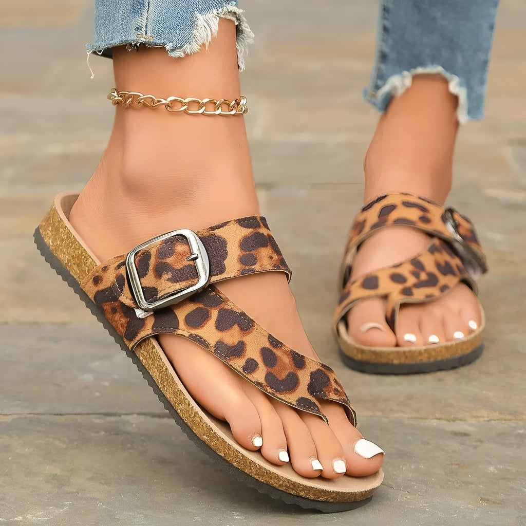 Leopard print Roman style slippers with toe covering and wooden sole.