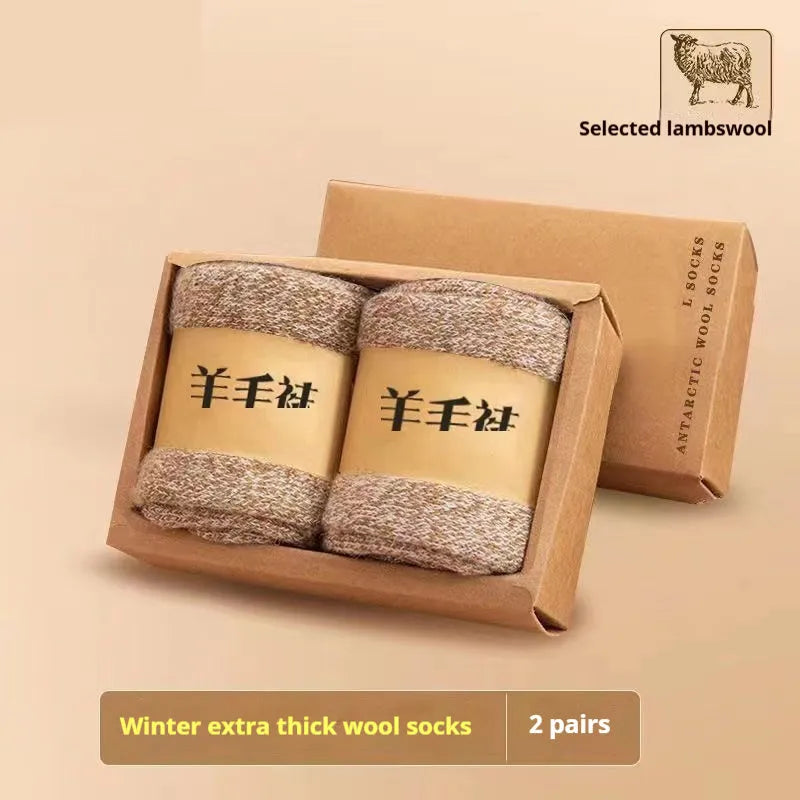 Two pairs of thick, solid-colour wool socks with a winter midsole, shown in cold-resistant cashmere colour options.