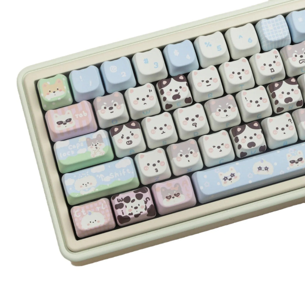 Full set of colourful PBT keyboard keycaps with sublimated cute puppy and cat designs laid out.