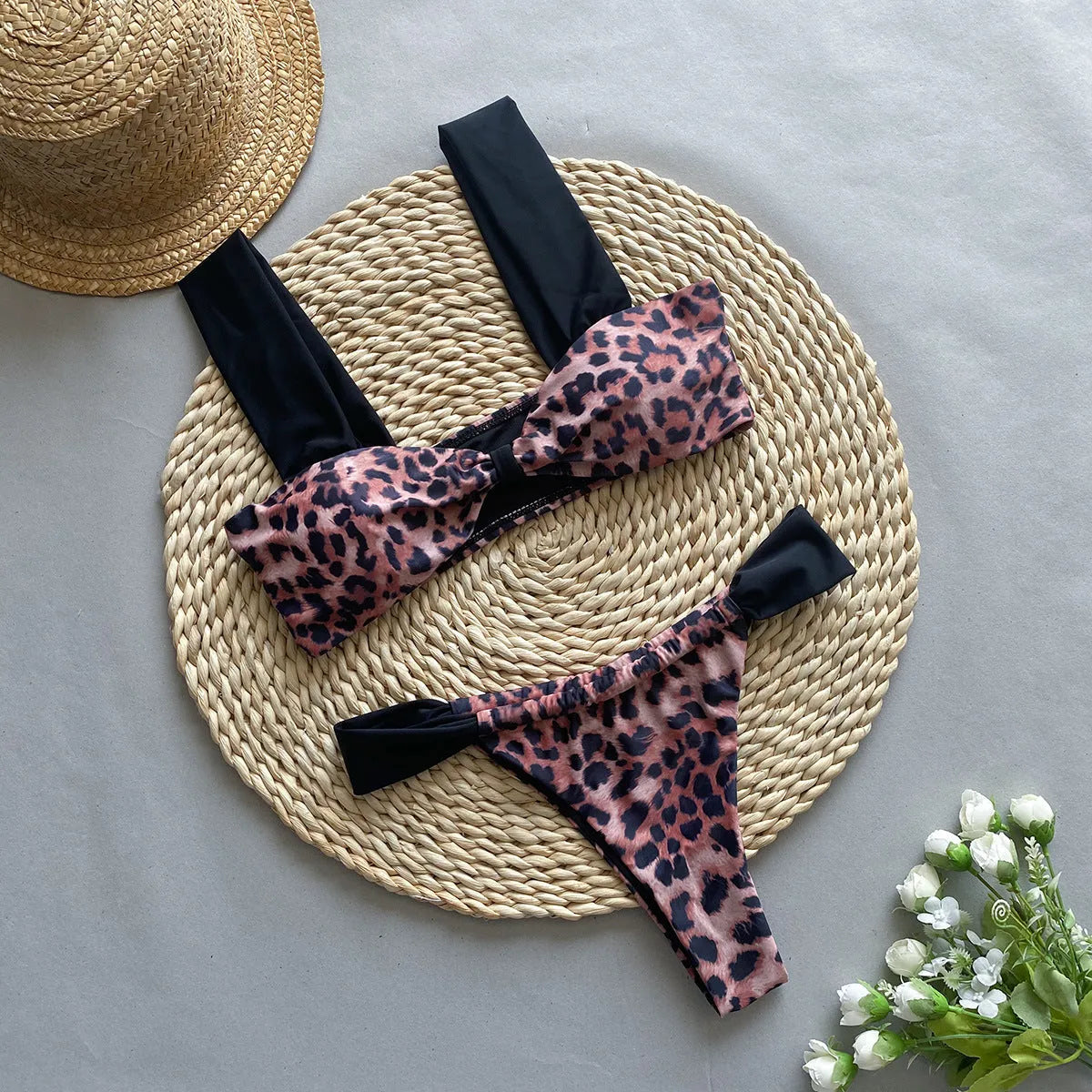 Women's leopard print bikini set with sleeveless tube top and matching swimsuit bottoms.