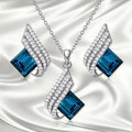 Women's electroplated necklace and earring set with alloy pendant and cross chain glass ornament