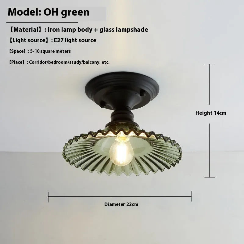 American retro style single-head ceiling or wall lamp with a glass cover.