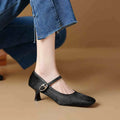Black square toe stiletto ankle-strap heels with horse hair upper and buckle closure