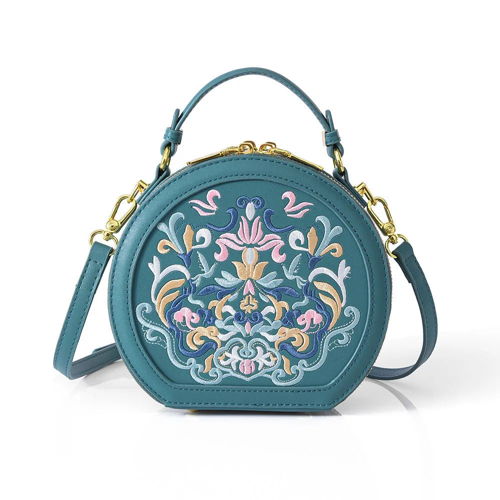 Round PU leather crossbody bag with embroidery and sewing line, available in five colours