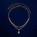Gold rhinestone waist chain with water drop pendant and tassel detailing on adjustable 115 cm chain