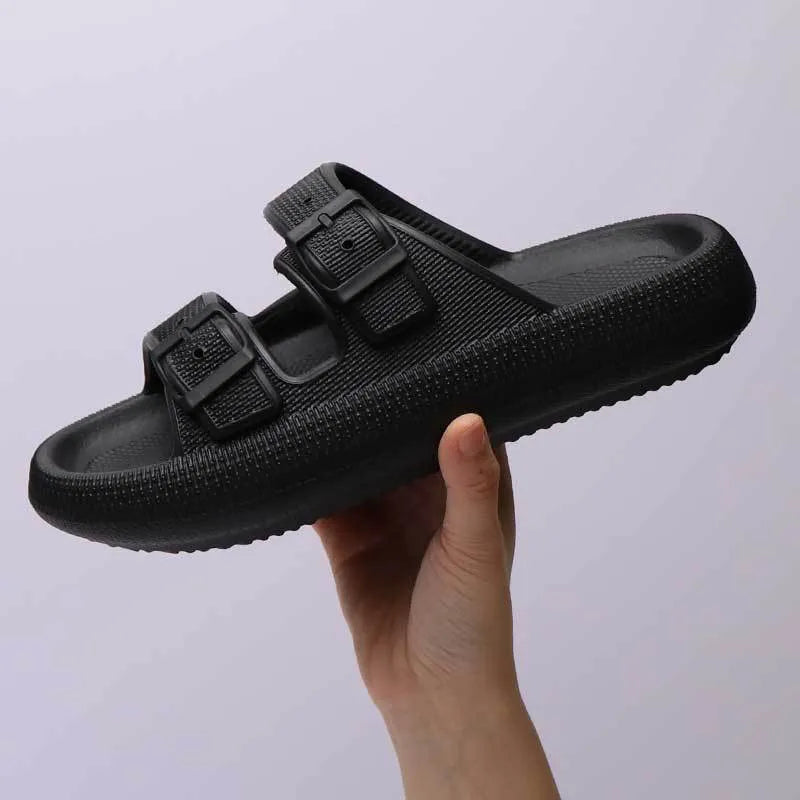 Women's beige platform slippers with buckle fastening and round toe on a flat surface