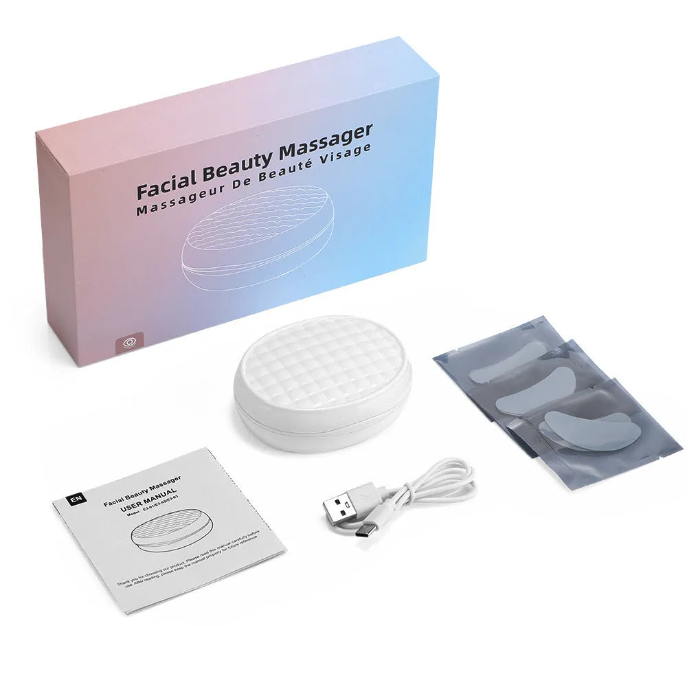 White wireless red light EMS eye and facial massager for home beauty treatment