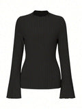 Black slim-fit long sleeve top with round neck and subtle sunken stripe pattern on soft brushed fabric.