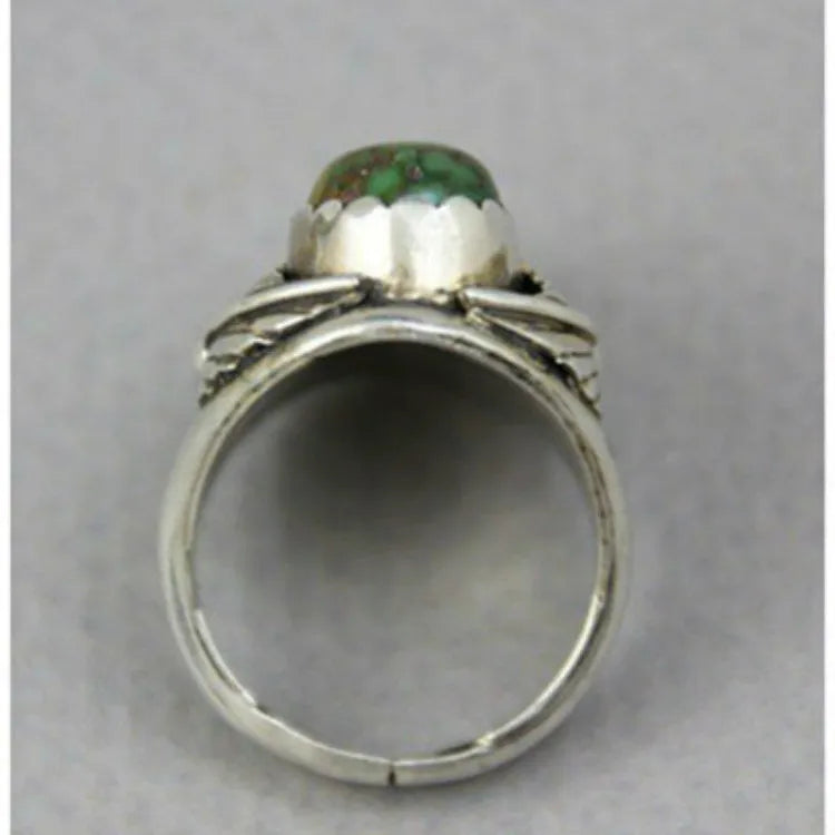 Women's silver-toned geometric alloy ring with a square turquoise blue inlaid centre on a white background.