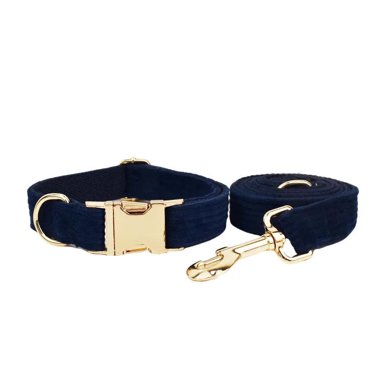 Navy blue corduroy dog collar and leash set with matching bow, vest, and poop bag