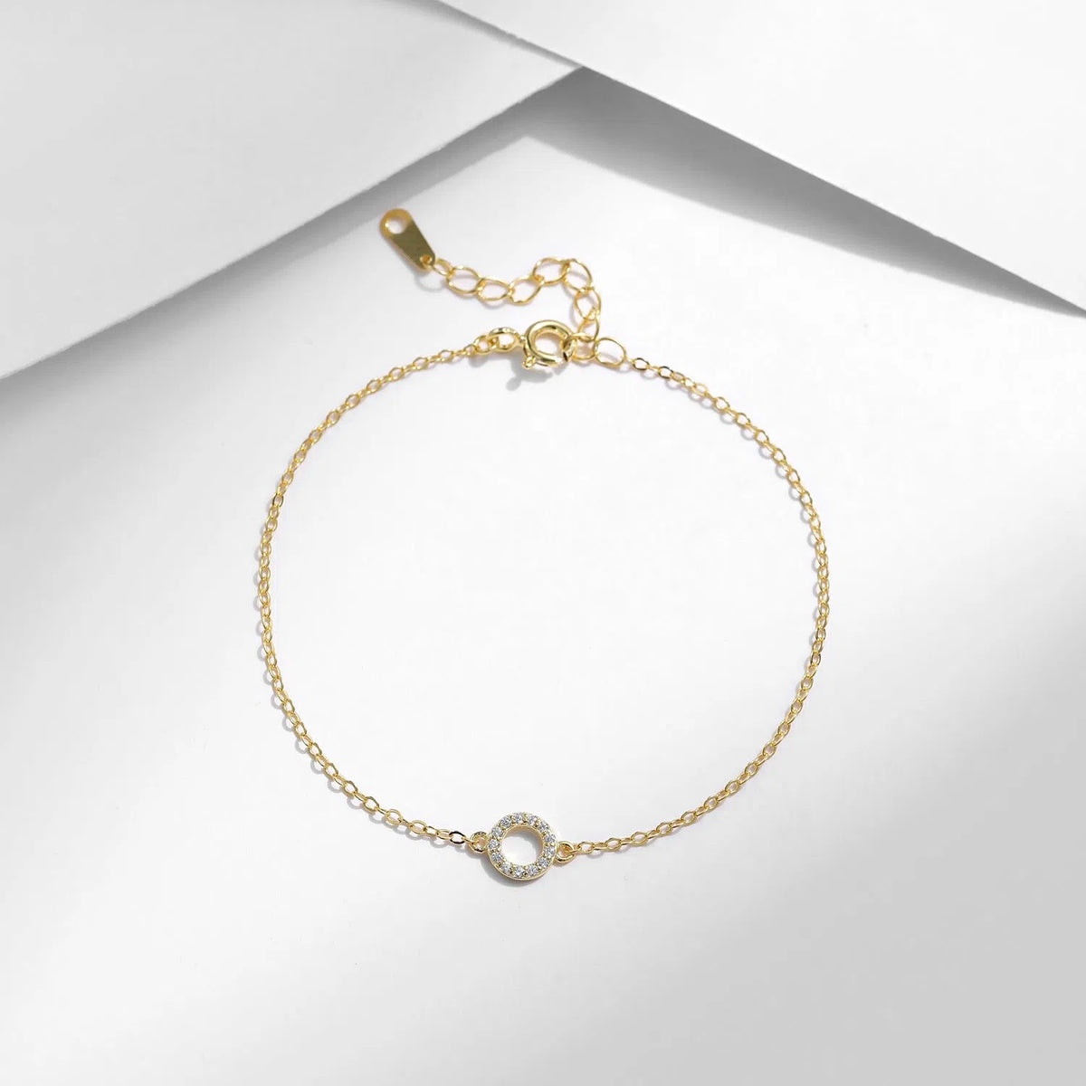 S925 sterling silver women's mini circle bracelet in gold colour with geometric round shape and micro-setting detail