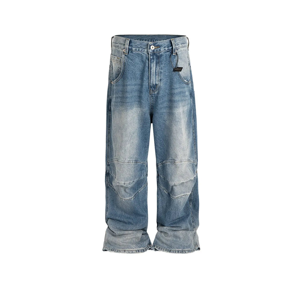 Blue baggy straight-leg jeans with a zip fly, shown in a washed white blue colour.