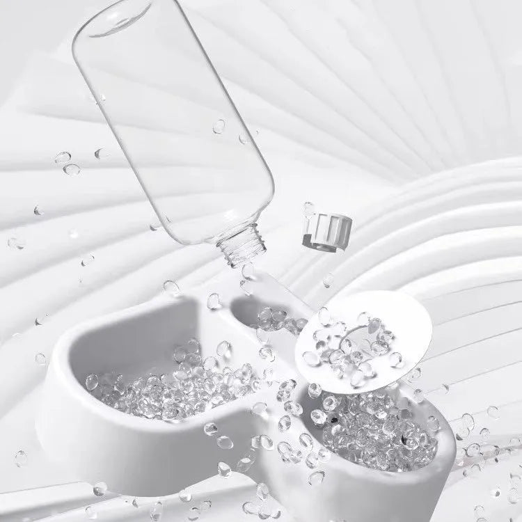 White pet water fountain for cats and dogs with four drinking mode settings.