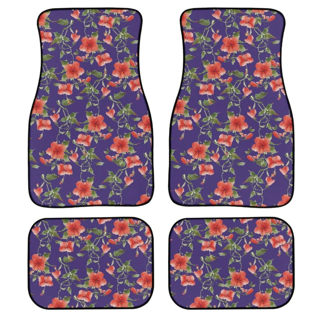 Black four-piece rubber car foot mat set with textured surface, shown on a car floor.