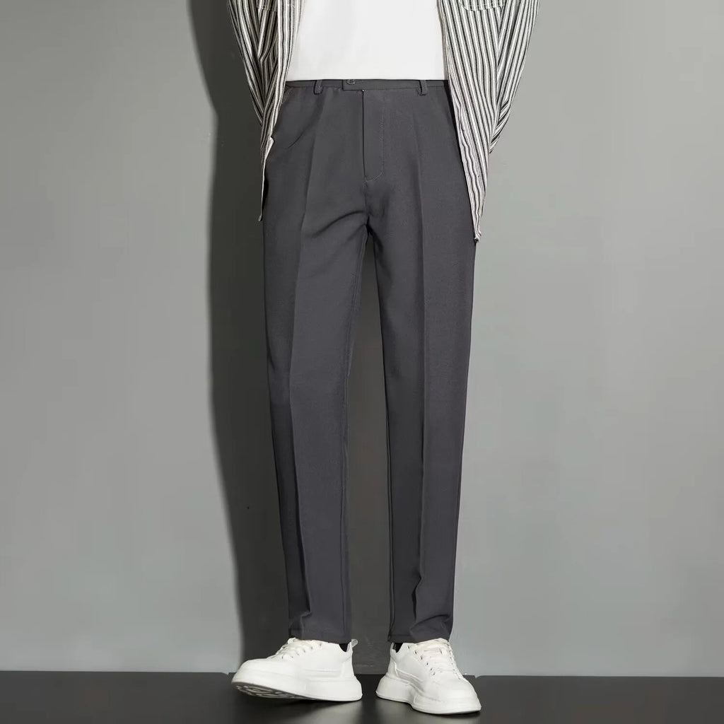 Men's straight cut ankle-length trousers in draping fabric showing apricot colour option