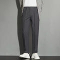 Men's straight cut ankle-length trousers in draping fabric showing apricot colour option