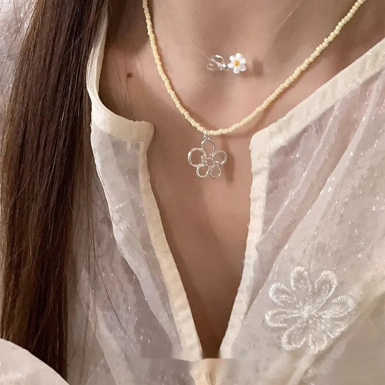 Women's electroplated copper hollow flower necklace with U-shaped pendant and English letters detail