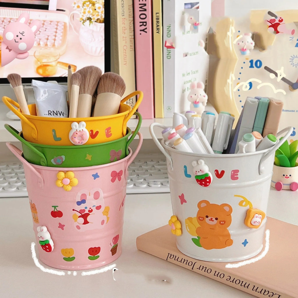 Round metal desk pen holder with iron art design in various colour options including pink, green, red, white and yellow