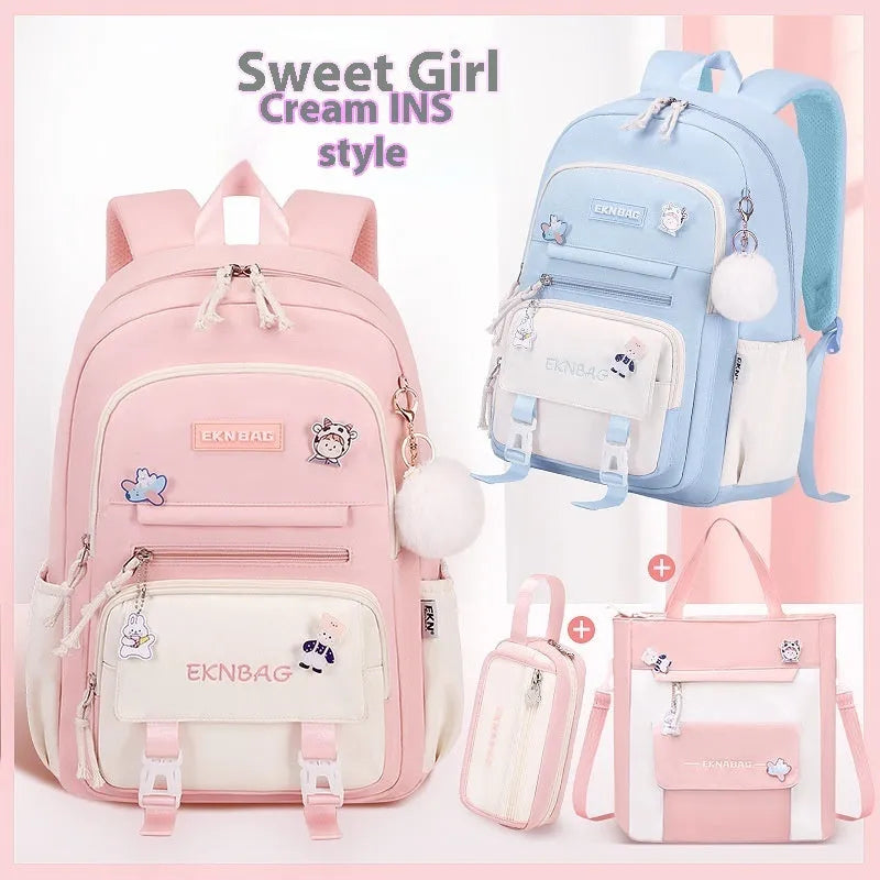 Pink waterproof school backpack set for girls with matching pencil case and tuition bag on a white background.