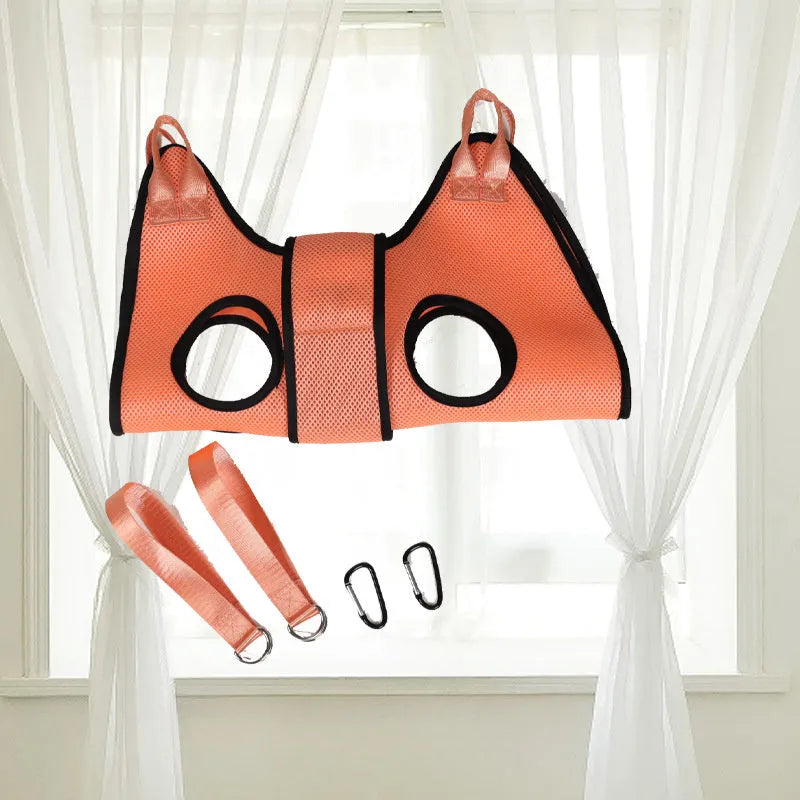 Cat secured in a hammock-style grooming restraint bag for nail cutting or bathing.