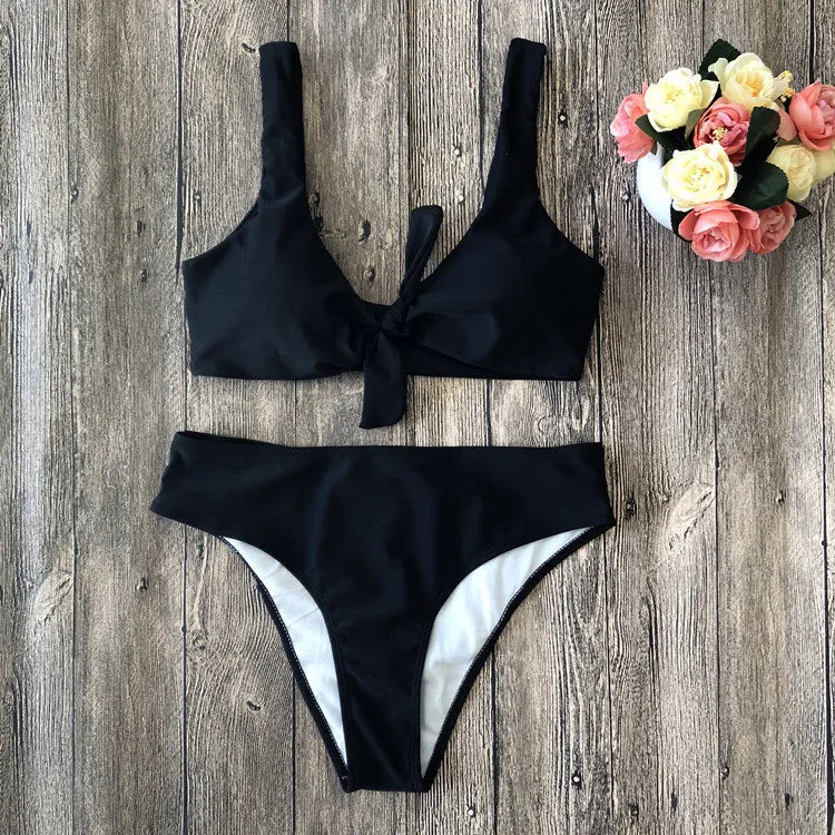 Women's solid colour bikini set with bra top and briefs in black, pink, red, white, or wine red.
