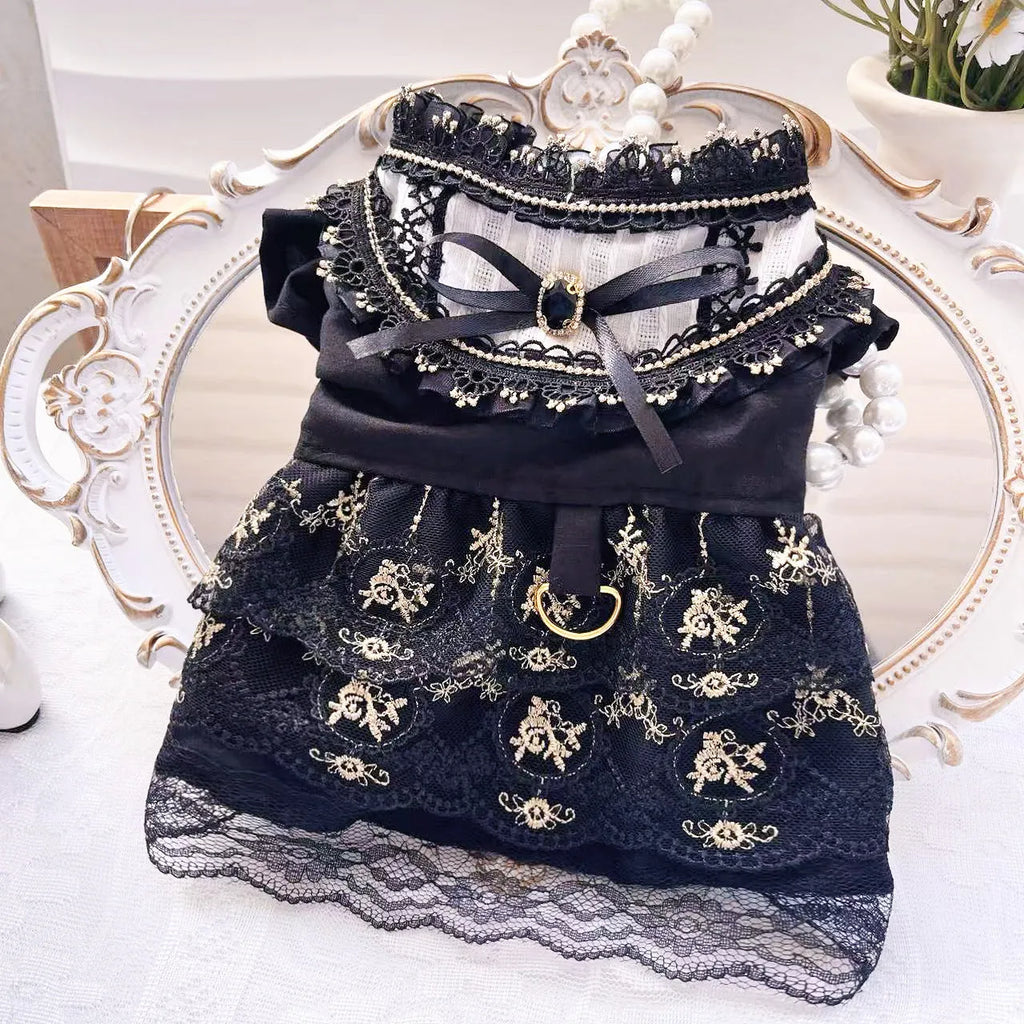 Golden gothic style skirt costume for a small dog or cat on a hanger.