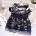 Golden gothic style skirt costume for a small dog or cat on a hanger.