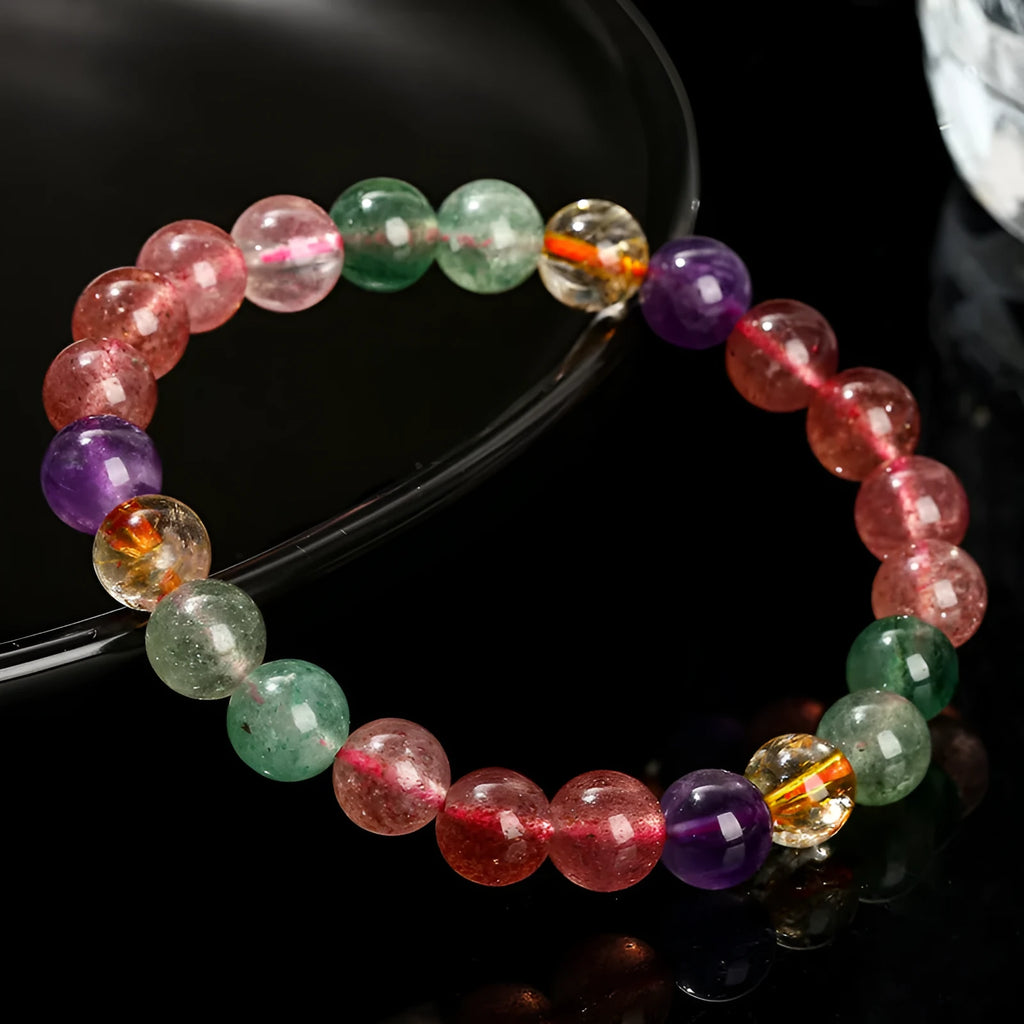 Women's strawberry quartz bracelet with tourmaline colour in round 7mm, 8mm, and 9mm bead sizes.