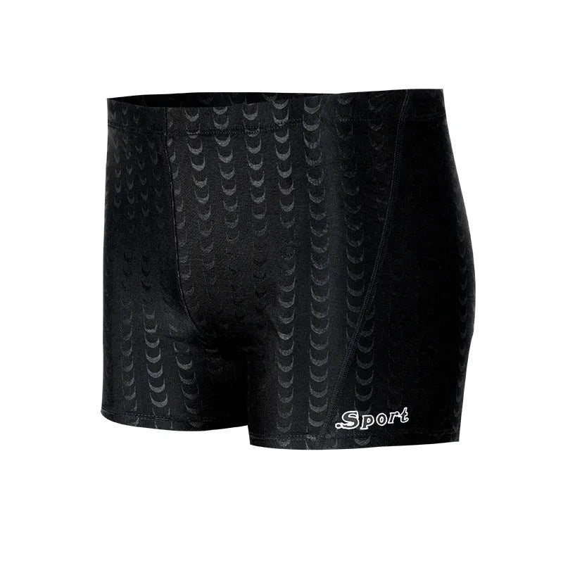 Men's solid colour swimming trunks in shark skin polyester fabric for surfing.