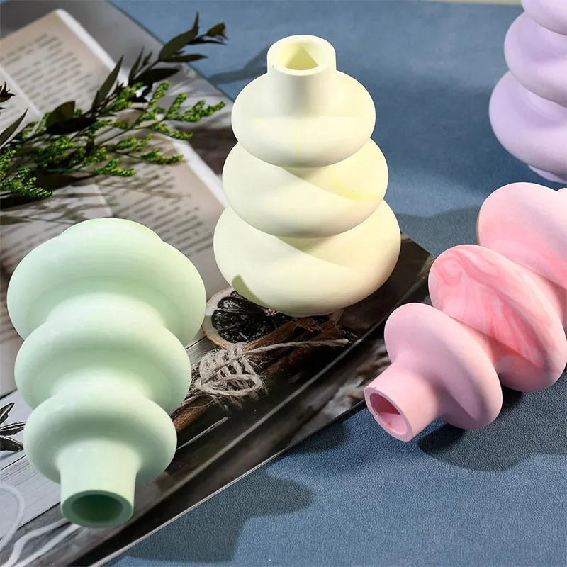 Silicone crafting mould for making three-layer irregular circle vase ornaments in small and large sizes.