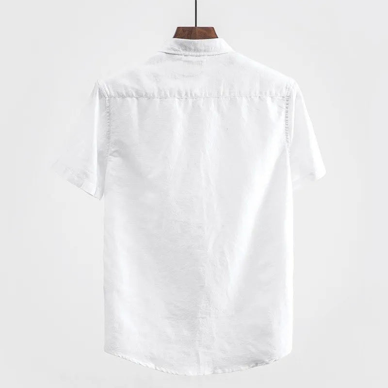 Men's light blue linen short sleeve shirt with a square collar on a hanger.
