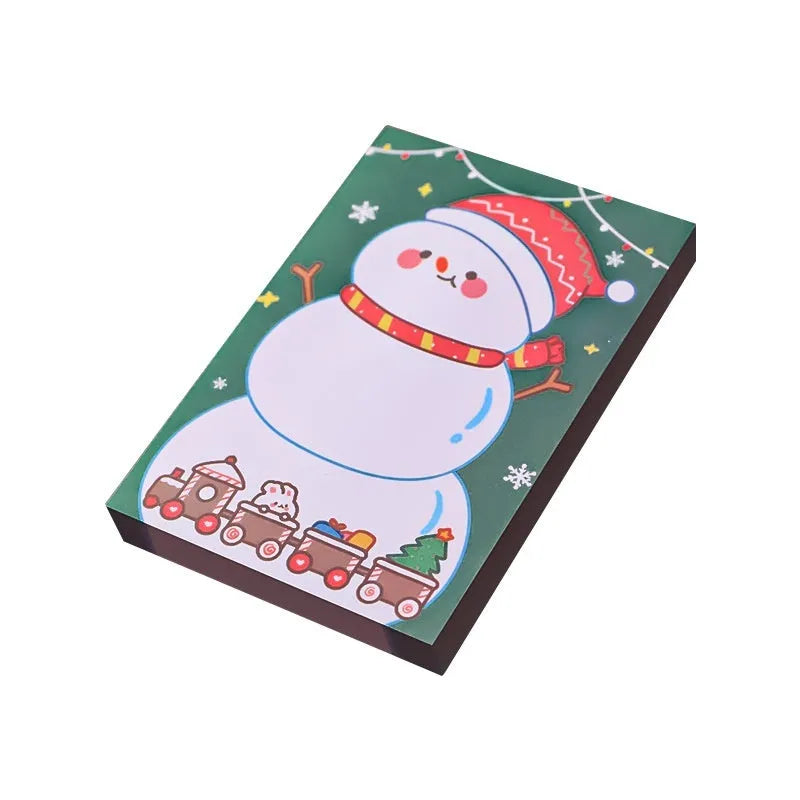 Christmas sticky notes book with festive designs of bear, elf, gift, house, sled, snowman, crystal ball, and Santa Claus.