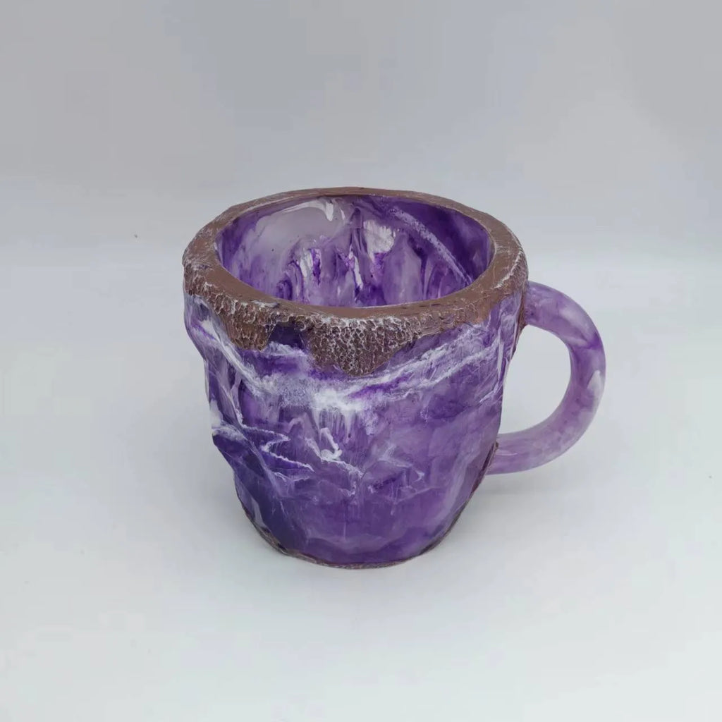 400ml resin mineral crystal coffee mug with handle, 10cm high, purple colour, on a table