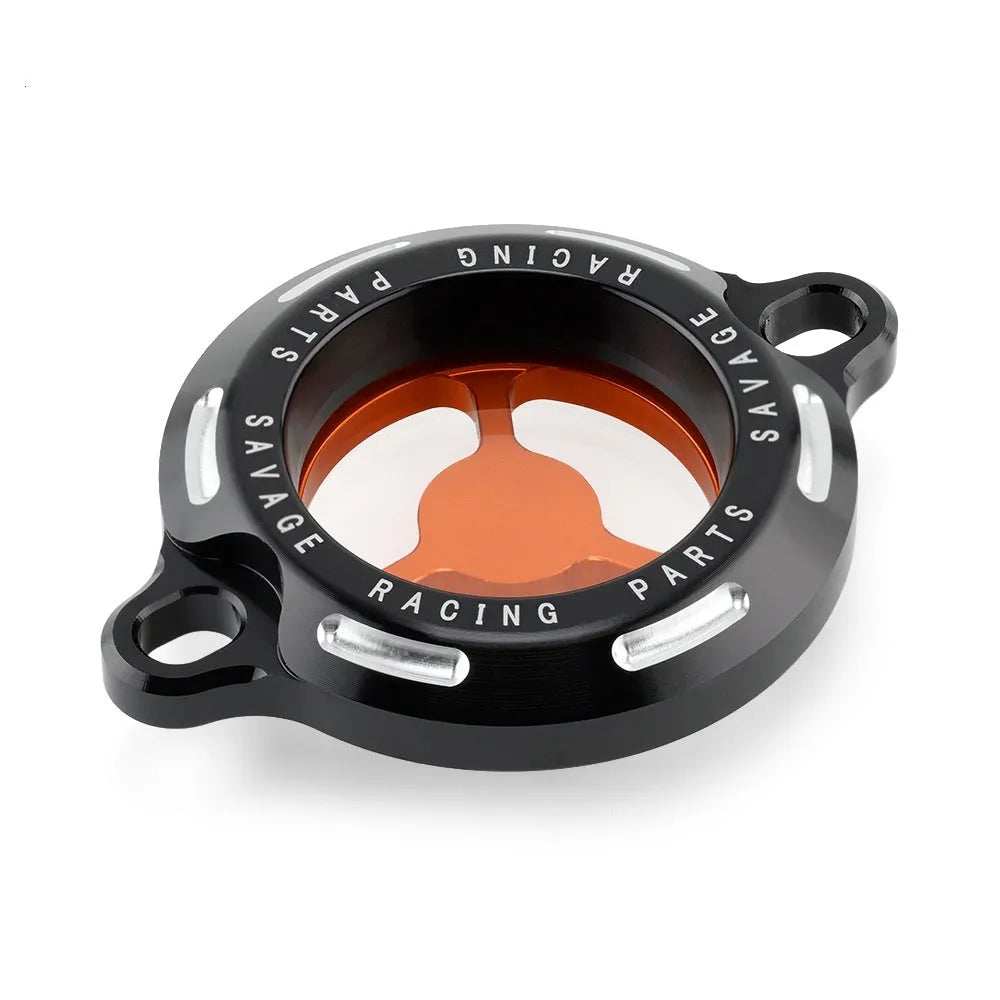 Aluminium alloy transparent oil filter cover for KTM DUKE motorcycles on a workbench