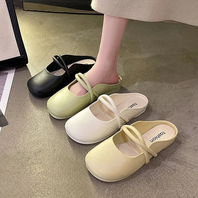 Women's black flip flop sandals with a toe cap design on a white background.