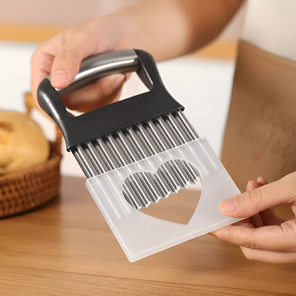 Stainless steel potato wave knife with black handle on a wooden kitchen surface.