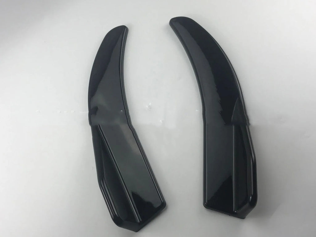 Front and rear car deflector kit for GM vehicles in black and carbon fibre finishes.