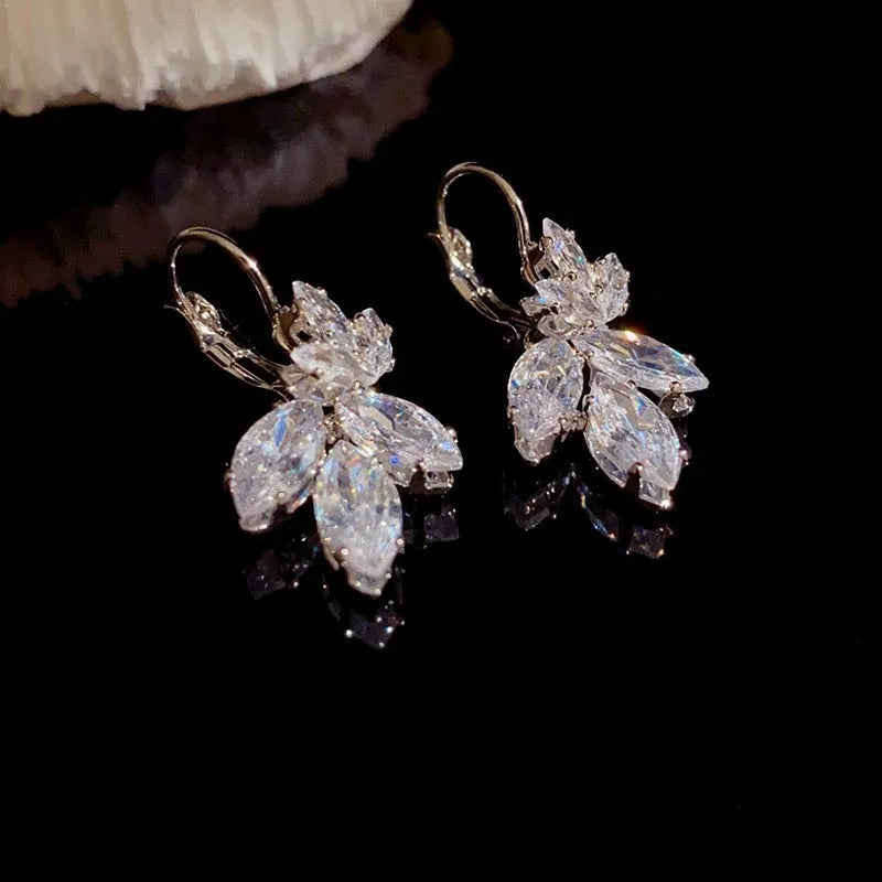 Platinum colour leaf earrings with shiny inlaid zircon stones