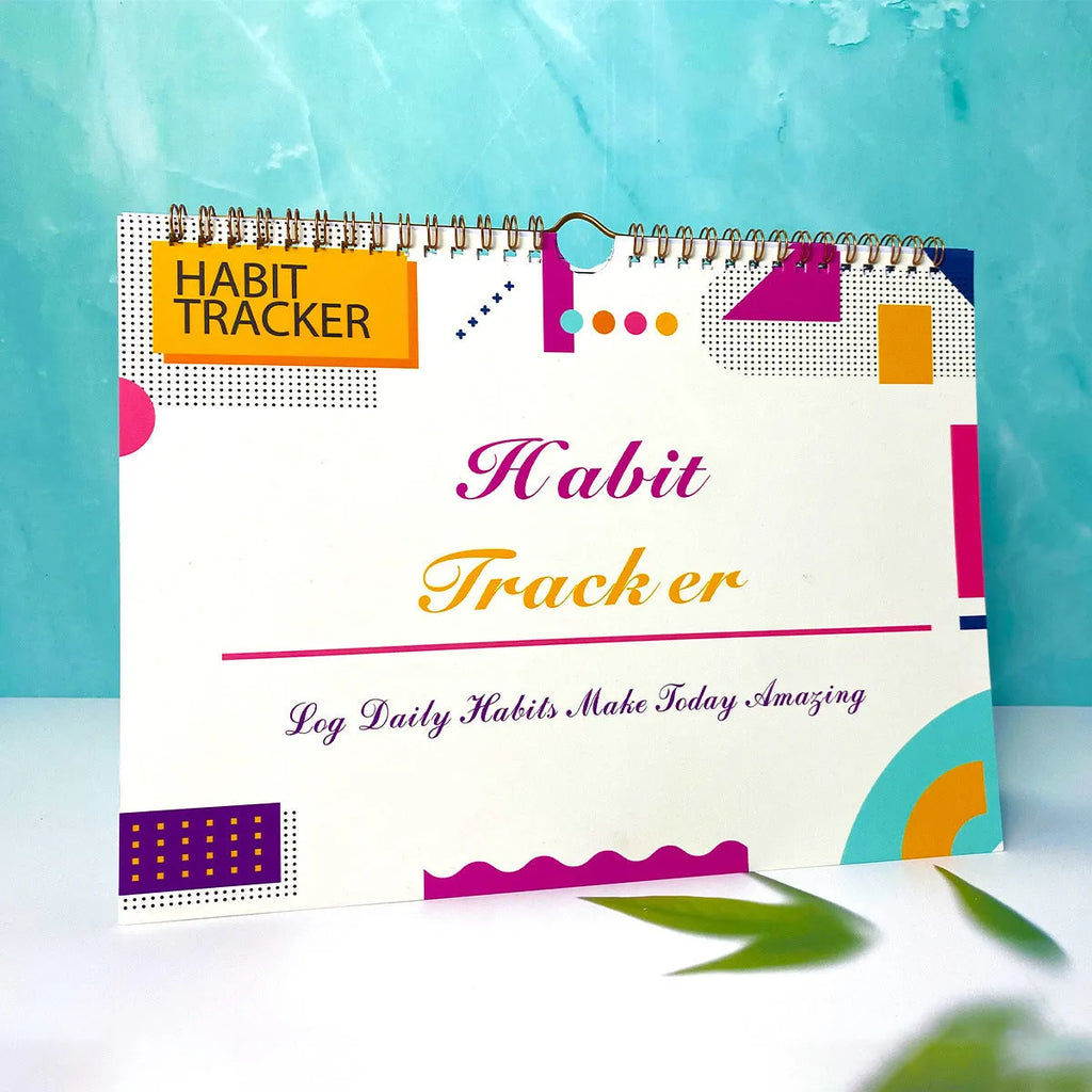 English habit tracking notebook open showing 12 internal pages with A4 21x28cm dimensions