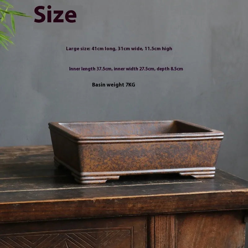 Rectangular purple sand bonsai pot with firewood burning finish and five-line basin design.