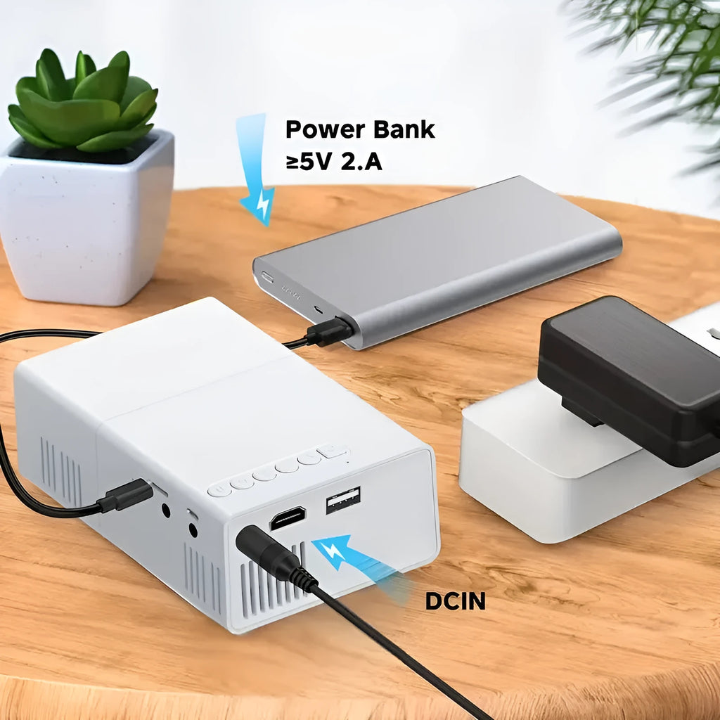 M100 mini home LED projector in black colour showing remote control and power cables