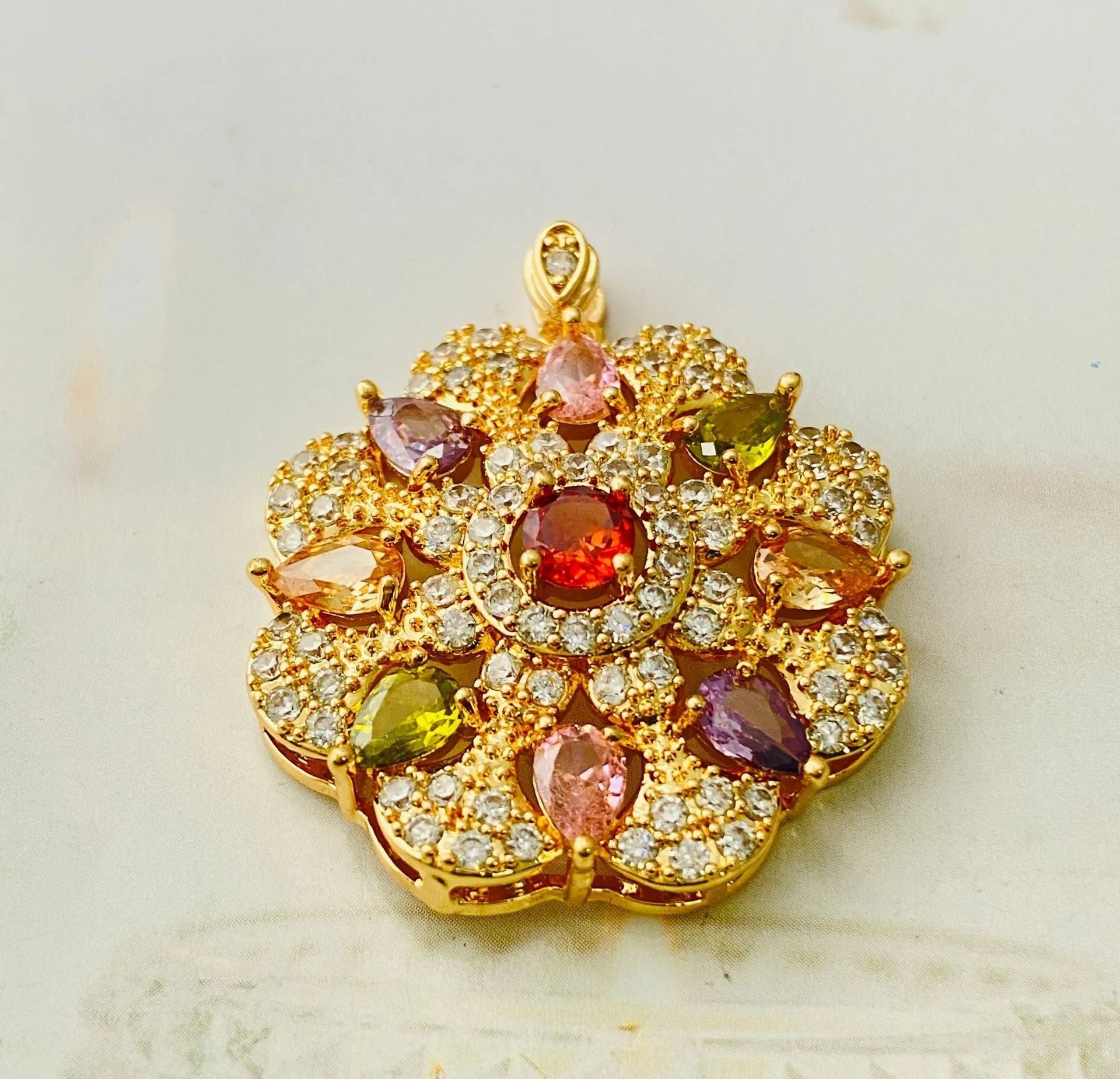 Close-up of a women's flower-shaped zircon pendant necklace in a gold electroplated finish.
