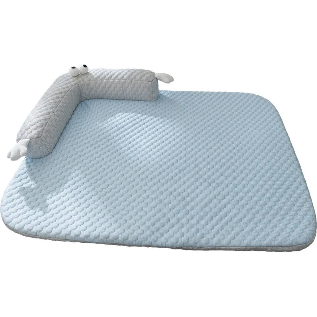 Blue pet bed cushion with big-eyed monster design for dogs and cats on a wooden floor
