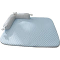 Blue pet bed cushion with big-eyed monster design for dogs and cats on a wooden floor