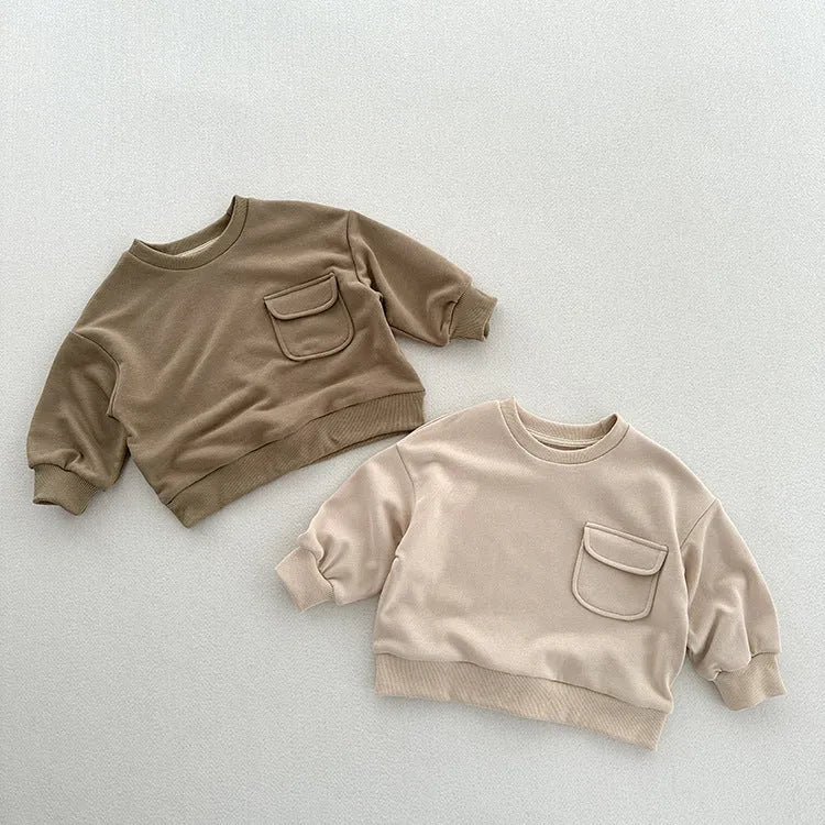 Solid colour cotton pullover for children with loose fit and pockets in Ivory White